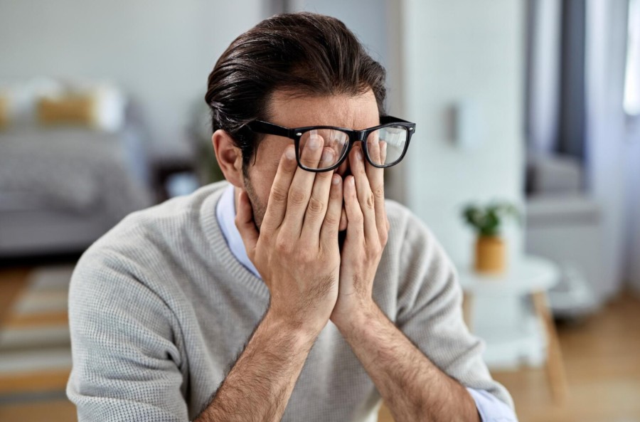 Frustrated man wondering how to stop overthinking
