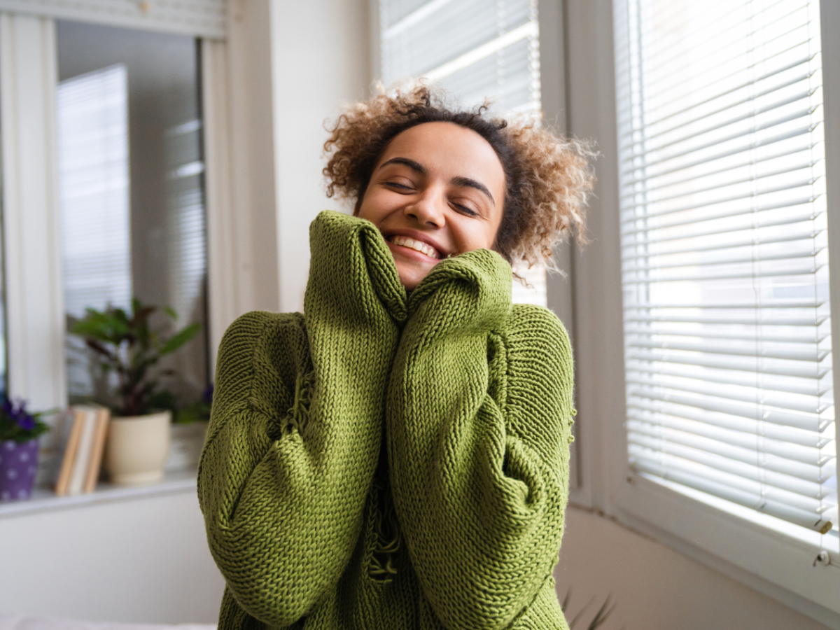 Happy woman in green sweater - Chad Weller